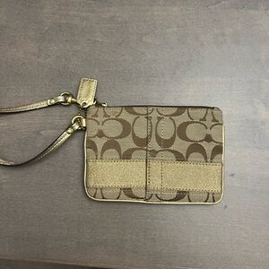 Coach small wristlet. Brown with (C’s) on it. Gold acccenta